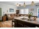 Open concept kitchen and living room with an island and double sink at 476 Rockville Rd, Moncks Corner, SC 29461