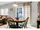 Cozy dining area with a table and four chairs, near a sliding glass door at 476 Rockville Rd, Moncks Corner, SC 29461