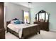 Spacious bedroom with a large bed, dresser, and plenty of natural light at 476 Rockville Rd, Moncks Corner, SC 29461
