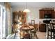 Charming wooden dining set in a bright kitchen with a view of the living room at 476 Rockville Rd, Moncks Corner, SC 29461