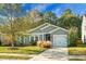 Single-story house with gray siding, driveway, and lush lawn at 476 Rockville Rd, Moncks Corner, SC 29461