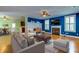 Bright living room with hardwood floors, fireplace and large TV at 1751 Bee Balm Rd Rd, Johns Island, SC 29455