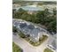Aerial view of a beautiful neighborhood with houses and a lake at 1751 Bee Balm Rd Rd, Johns Island, SC 29455