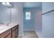 Bathroom with light blue walls, double vanity and shower at 1751 Bee Balm Rd Rd, Johns Island, SC 29455