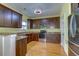 Kitchen with dark wood cabinets, granite counters and stainless steel appliances at 1751 Bee Balm Rd Rd, Johns Island, SC 29455