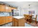 Kitchen with oak cabinets, white quartz island and stainless steel refrigerator at 323 Bradley Bend Dr, Moncks Corner, SC 29461