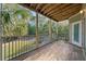 Relaxing screened porch with wood floors and wooded views at 1012 Basildon Rd, Mount Pleasant, SC 29466