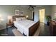 Bright bedroom with a queen bed, wooden frame, and ensuite bathroom access at 6805 Sc-162, Hollywood, SC 29449