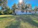 Front view of a charming white house with a deck at 6805 Sc-162, Hollywood, SC 29449