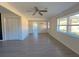 Open living area with hardwood floors, neutral walls, and ceiling fan at 6805 Sc-162, Hollywood, SC 29449
