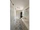 Updated bathroom with double vanity, patterned tile floor, and a walk-in shower at 6805 Sc-162, Hollywood, SC 29449