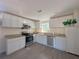 Modern kitchen with white cabinets, granite countertops, and stainless steel appliances at 6805 Sc-162, Hollywood, SC 29449