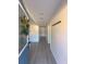 Bright entryway with grey vinyl flooring and coat rack at 6805 Sc-162, Hollywood, SC 29449