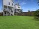 Large grassy backyard with privacy fence at 4447 Oakwood Ave, North Charleston, SC 29405