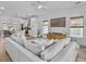 Open concept living room with a view into the kitchen at 4447 Oakwood Ave, North Charleston, SC 29405