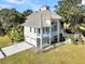 Two-story home with a metal roof and a two car garage at 1109 Pinefield Dr, Wando, SC 29492