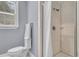 Small bathroom with shower, toilet, and white linens at 1109 Pinefield Dr, Wando, SC 29492