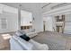 Living room with hardwood floors, white sofas, and view of staircase at 1109 Pinefield Dr, Wando, SC 29492