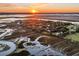 Aerial view of waterfront homes at sunset at 1109 Pinefield Dr, Wando, SC 29492