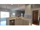 Kitchen island with sink, looking toward living room at 1450 Coopers Hawk Dr, Hanahan, SC 29410