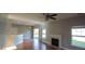 Spacious living area with hardwood floors, fireplace and access to backyard at 1450 Coopers Hawk Dr, Hanahan, SC 29410