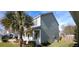 Two-story house with gray siding and front porch at 1450 Coopers Hawk Dr, Hanahan, SC 29410