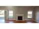 Living room with fireplace and hardwood floors, offering a cozy atmosphere at 1450 Coopers Hawk Dr, Hanahan, SC 29410