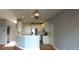Open concept kitchen with island and pendant lighting at 1450 Coopers Hawk Dr, Hanahan, SC 29410