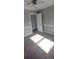Well-lit bedroom with window and door to another room at 1450 Coopers Hawk Dr, Hanahan, SC 29410