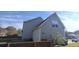 Two-story house with vinyl siding and a large backyard at 1450 Coopers Hawk Dr, Hanahan, SC 29410