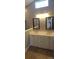 Double vanity with white cabinets and a granite countertop at 1450 Coopers Hawk Dr, Hanahan, SC 29410