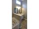 Bathroom with a corner tub and double vanity at 1450 Coopers Hawk Dr, Hanahan, SC 29410