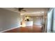 Open concept living space with hardwood floors and kitchen views at 1450 Coopers Hawk Dr, Hanahan, SC 29410