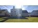View of the home's back exterior and yard at 1450 Coopers Hawk Dr, Hanahan, SC 29410