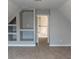 Bedroom with built-in shelving and access to upper hallway at 1450 Coopers Hawk Dr, Hanahan, SC 29410