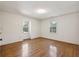 Simple bedroom with hardwood floors and two windows at 810 Creekside Dr, Mount Pleasant, SC 29464