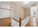 Upstairs hallway with floral wallpaper, hardwood floors, and a staircase at 810 Creekside Dr, Mount Pleasant, SC 29464