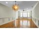 Spacious living room with hardwood floors and large windows at 4252 Faber Place Dr # 203, North Charleston, SC 29405