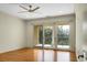 Bedroom with hardwood floors and access to private balcony at 4252 Faber Place Dr # 203, North Charleston, SC 29405