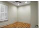 Empty bedroom with hardwood floors and window with shutters at 4252 Faber Dr # 203, North Charleston, SC 29405