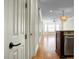 Light-filled hallway with hardwood floors leading to a spacious living area at 4252 Faber Place Dr # 203, North Charleston, SC 29405