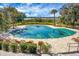Community pool with green cover, surrounded by lounge chairs at 4252 Faber Place Dr # 203, North Charleston, SC 29405