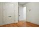 Empty bedroom with hardwood floors, window with shutters and double doors at 4252 Faber Place Dr # 203, North Charleston, SC 29405