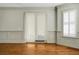 Living room with hardwood floors and view to hallway at 4252 Faber Place Dr # 203, North Charleston, SC 29405