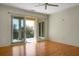 Bedroom with hardwood floors and access to balcony with water views at 4252 Faber Place Dr # 203, North Charleston, SC 29405