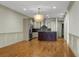 Open kitchen with hardwood floors, stainless steel appliances, and an island at 4252 Faber Place Dr # 203, North Charleston, SC 29405