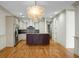 Open concept kitchen with island and hardwood floors at 4252 Faber Place Dr # 203, North Charleston, SC 29405