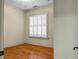 Spacious bedroom with hardwood floors and large window with shutters at 4252 Faber Place Dr # 203, North Charleston, SC 29405