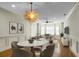 Bright dining room features hardwood floors and a marble table at 4252 Faber Place Dr # 203, North Charleston, SC 29405