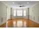 Large living room with hardwood floors and bay window at 4252 Faber Place Dr # 203, North Charleston, SC 29405